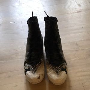 Black and white underarmor football cleats